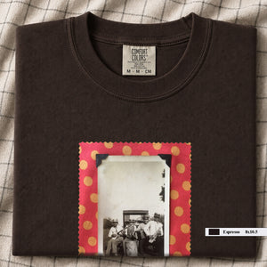 Dark brown colored folded t-shirt with large vintage photo of musicians playing