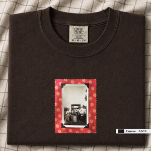 Dark brown colored folded t-shirt with small vintage photo of musicians playing