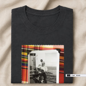 dark grey folded tee shirt with large vintage photo of guitar player on front