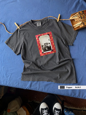 Gray tshirt on table with intage phot on front