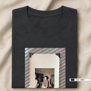 Grey folded t-shirt with large vintage photo of lady screaming