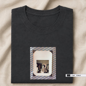 Grey folded t-shirt with small vintage photo of lady screaming