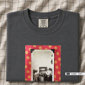 Grey colored folded t-shirt with large vintage photo of musicians playing