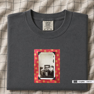 Grey colored folded t-shirt with small vintage photo of musicians playing