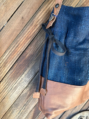 indigo cotton and leather cinch bag detail of straps