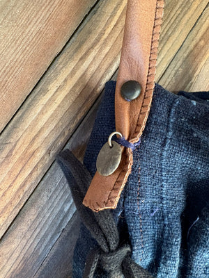 indigo cotton and brown leather bag pebble detail