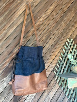 indigo cotton and brown leather cinch bag back view