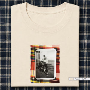 ivory folded tee shirt with small vintage photo of guitar player on front