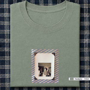 Sage green folded t-shirt with small vintage photo of lady screaming
