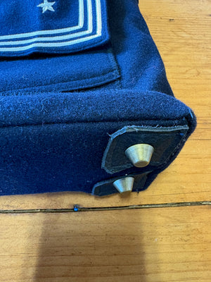 Detail of metal feet on a handmade sailor bag