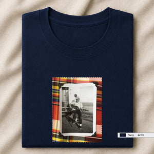 navy folded tee shirt with small vintage photo of guitar player on front