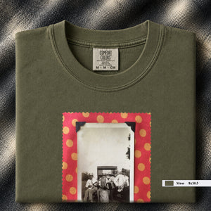 Olive colored folded t-shirt with large vintage photo of musicians playing