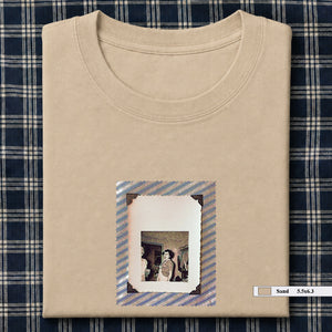 Sand colored folded t-shirt with small vintage photo of lady screaming