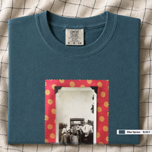 Teal colored folded t-shirt with large vintage photo of musicians playing