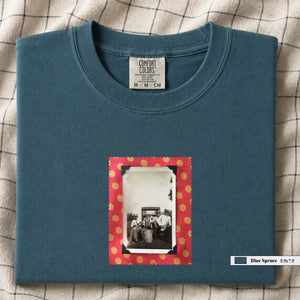 Teal colored folded t-shirt with vintage photo of musicians playing