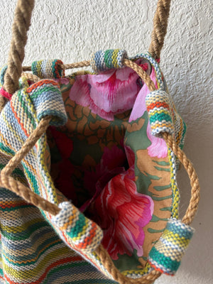 Interior of a colorful basket bag with soft rope strap