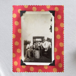 Vintage photo of musicians playing framed in polka dot fabric