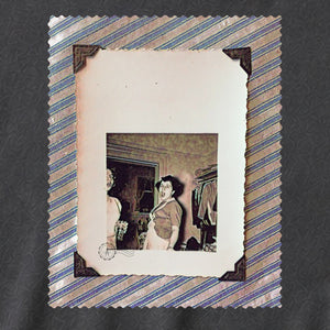 Vintage photo of screaming lady with black tabs framed in stripe fabric