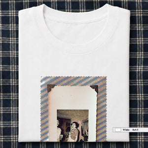 White folded t-shirt with large vintage photo of lady screaming