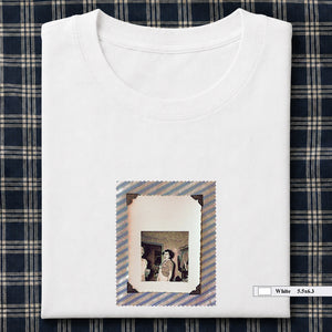 White folded t-shirt with small vintage photo of lady screaming