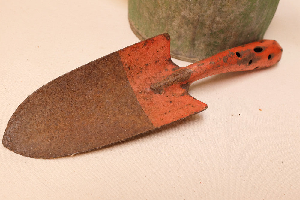 Rusty Watering Can and Shovel
