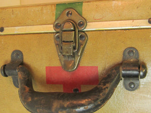Vintage Red Cross suitcase with military collectible design.