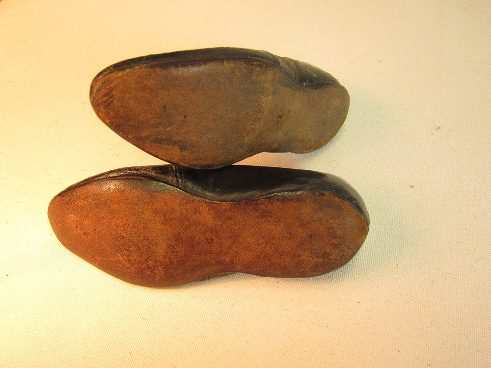 Vintage black leather doll shoes.