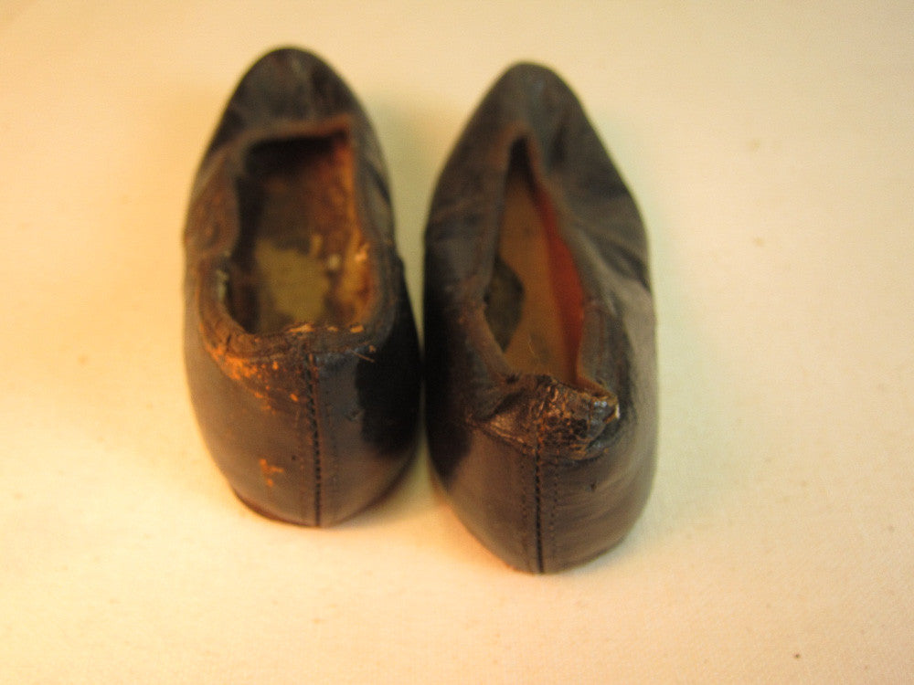 Vintage black leather doll shoes.