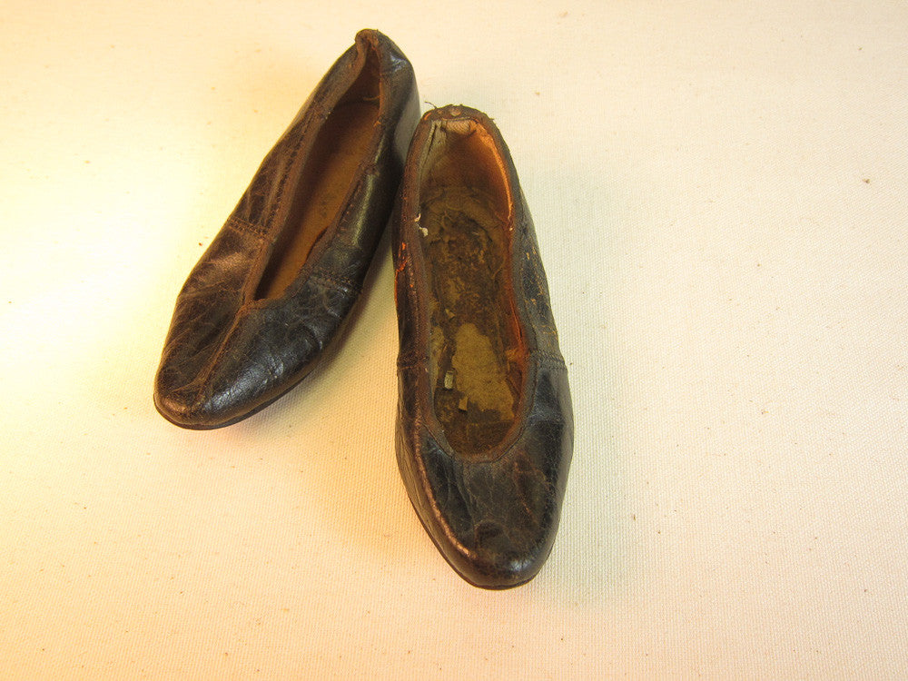 Vintage black leather doll shoes.