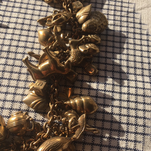 Vintage chubby charm necklace with antique jewelry design