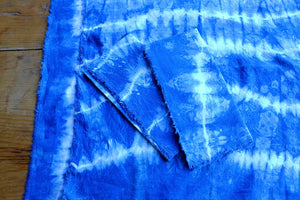 Handmade indigo tie-dyed linen napkins with unique designs.