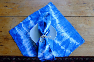 Handmade indigo tie-dyed linen napkins with unique designs.