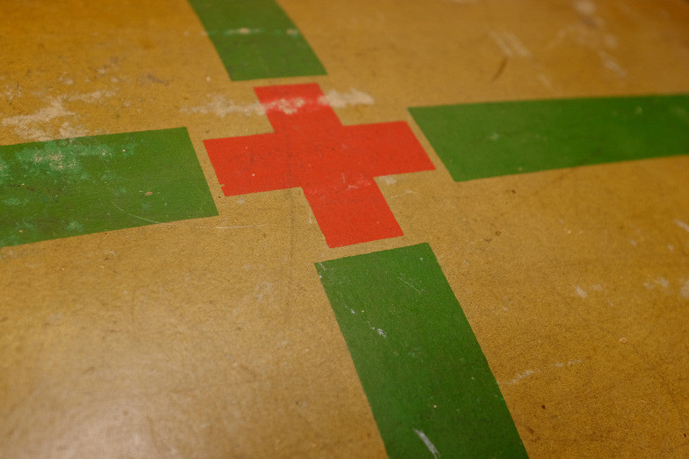 Vintage Red Cross suitcase with military collectible design.