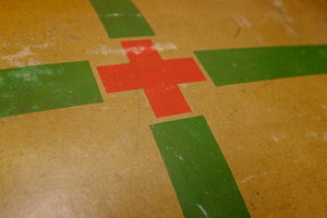 Vintage Red Cross suitcase with military collectible design.