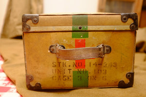 Vintage Red Cross suitcase with military collectible design.