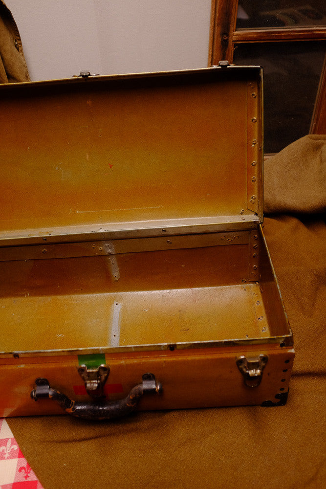 Vintage Red Cross suitcase with military collectible design.