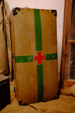 Vintage Red Cross suitcase with military collectible design.