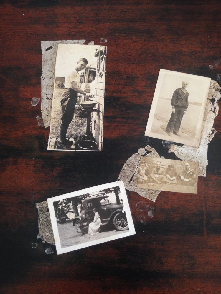 Colette's collaged desk with vintage photos and silver leaf accents.