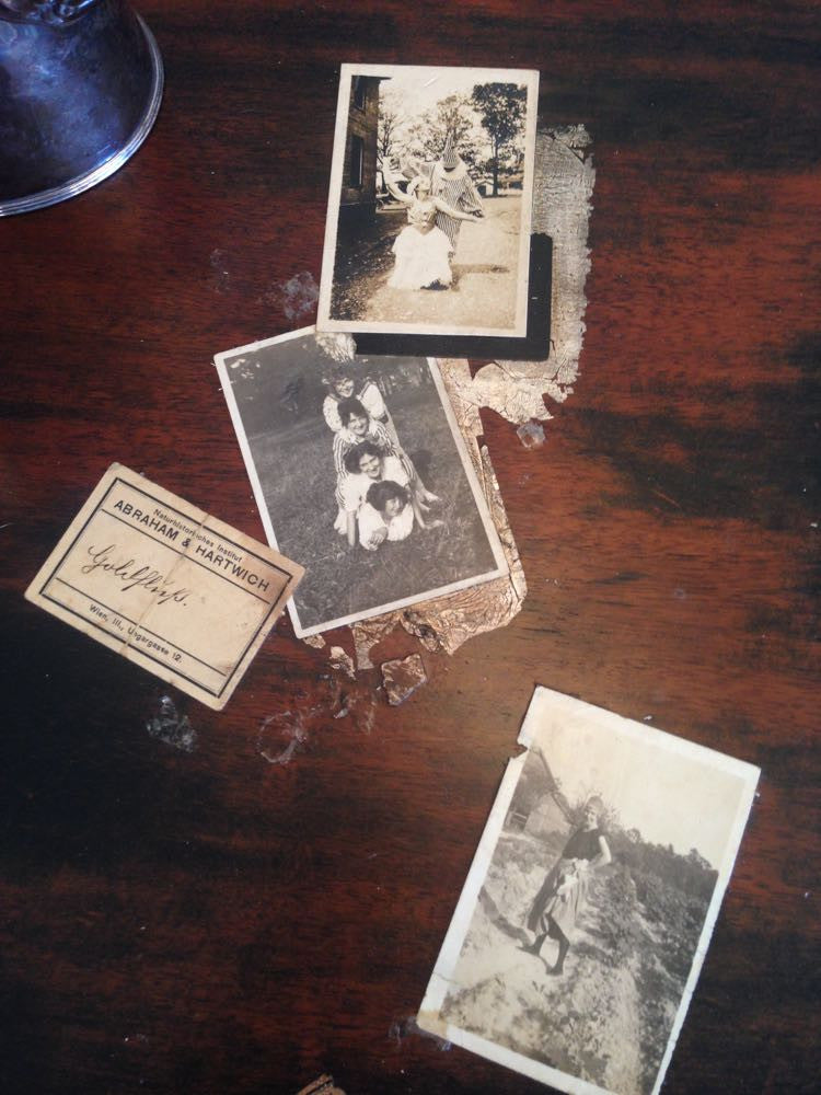 Colette's collaged desk with vintage photos and silver leaf accents.