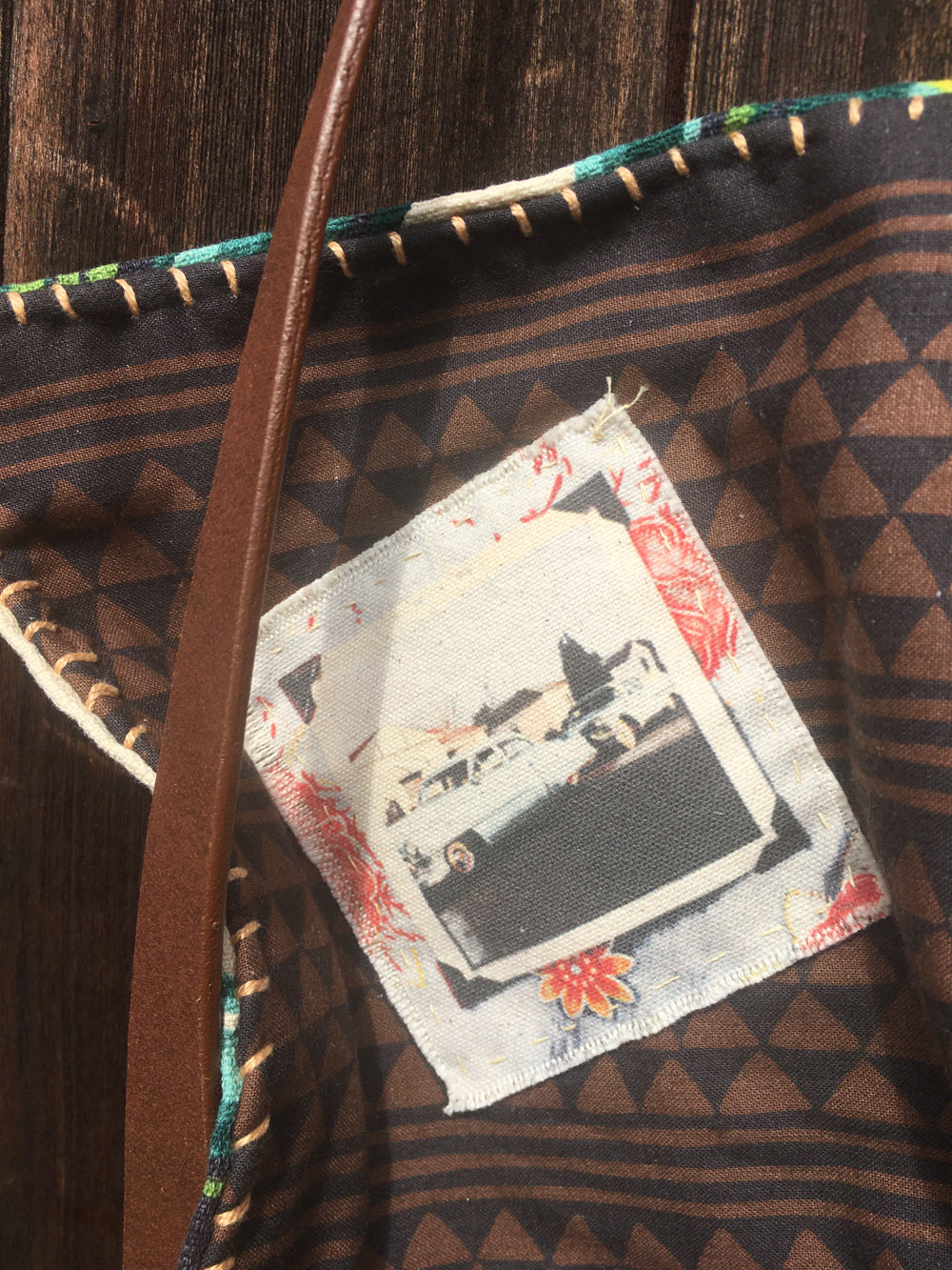 Upcycled barkcloth shoulder bag with vintage South Pacific design.