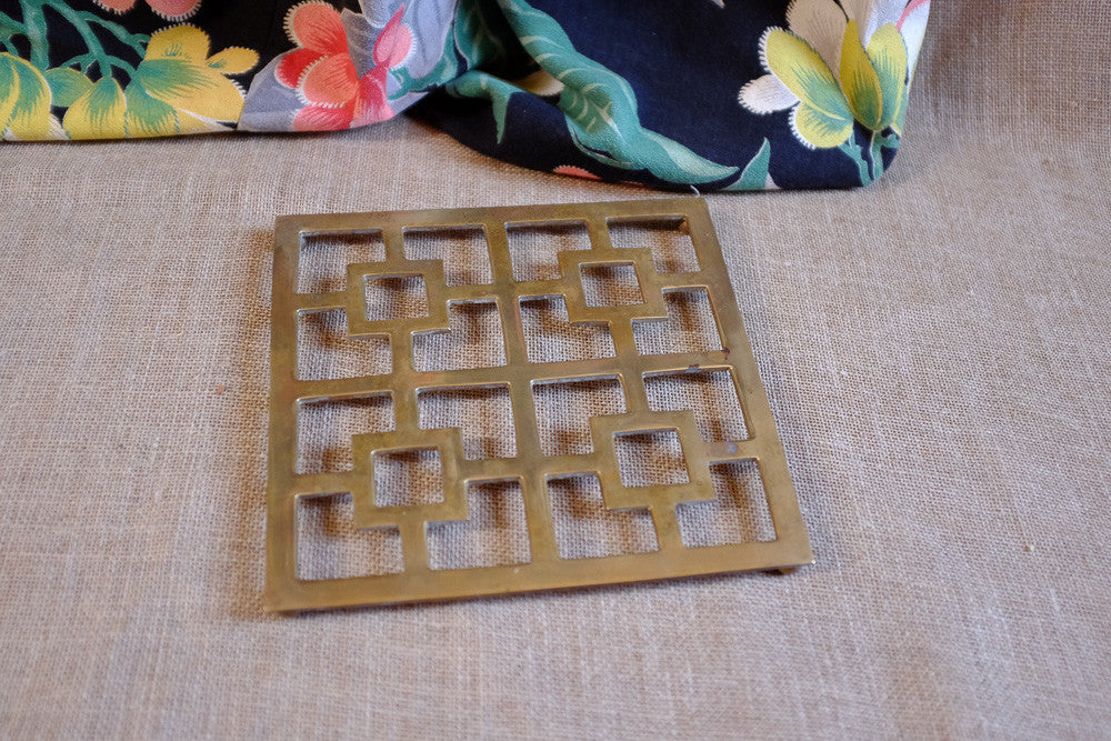 Mid-century Asian-style brass trivet