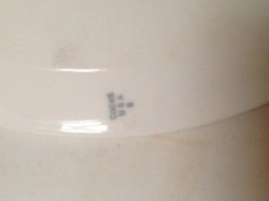 Vintage porcelain chemical bowls with laboratory equipment.
