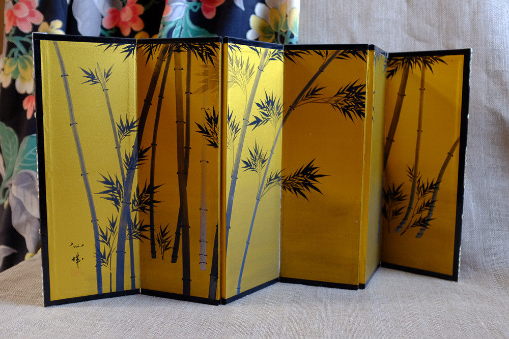 Painted paper screen with gold leaf accents 