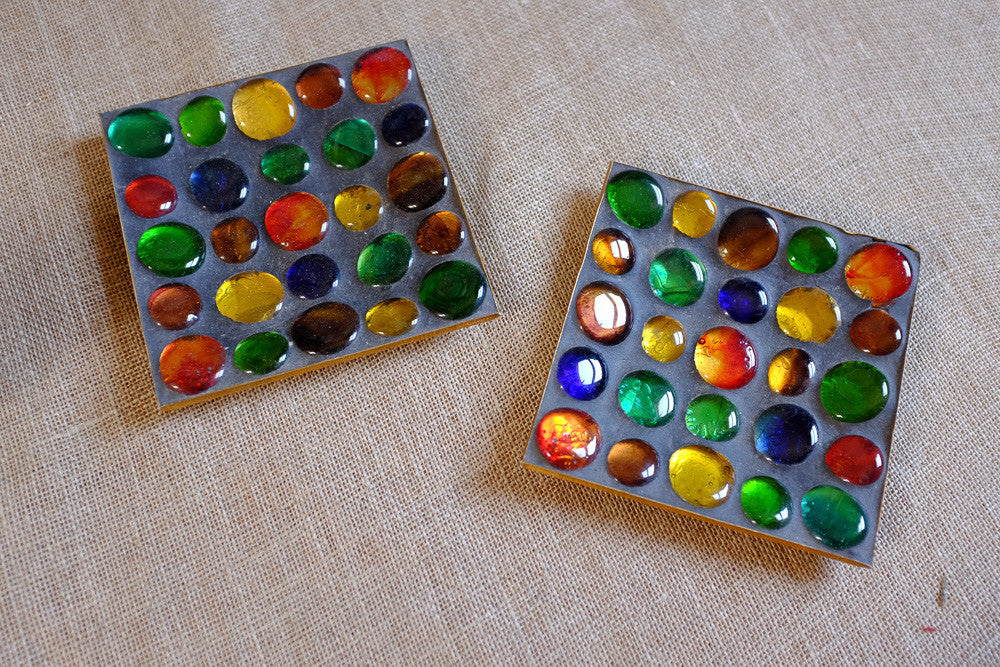 Colorful marble ashtray with glass marbles.