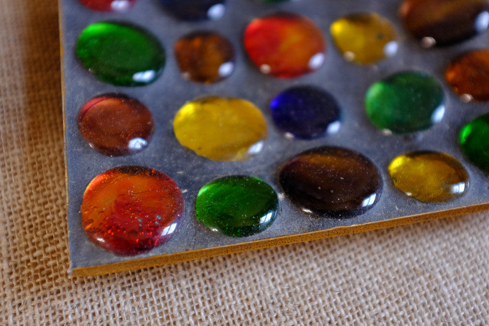 Colorful marble ashtray with glass marbles.