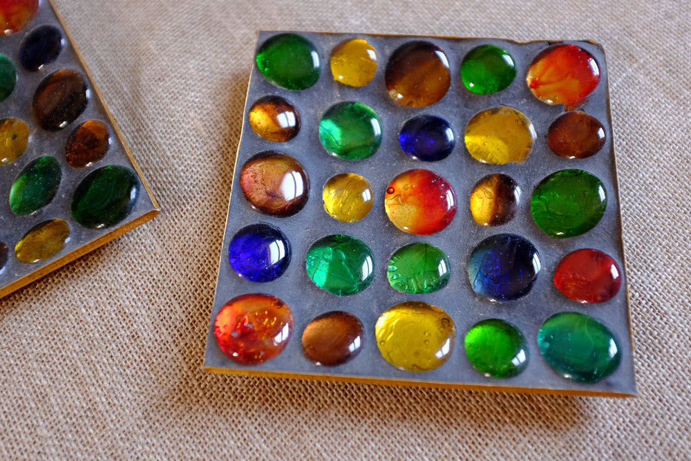 Colorful marble ashtray with glass marbles.