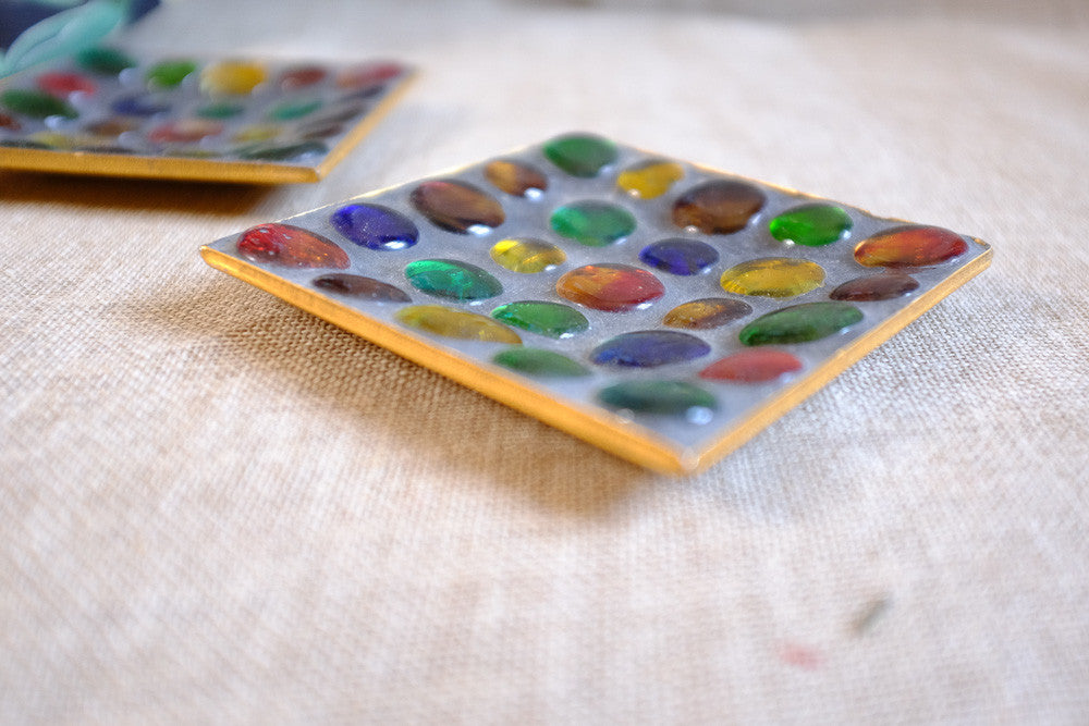 Colorful marble ashtray with glass marbles.