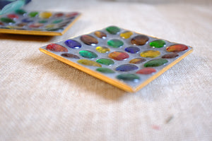Colorful marble ashtray with glass marbles.