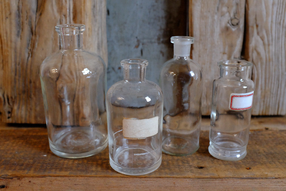 Vintage chemical bottles in various shapes and sizes