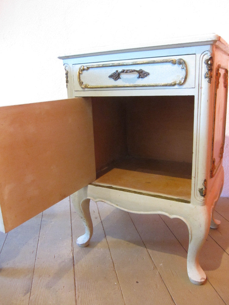 Vintage French parlour cabinets with original paint and gold details.